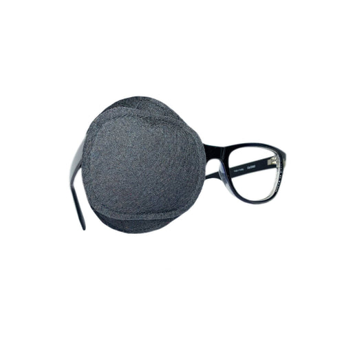 Charcoal gray eye patch attached to glasses