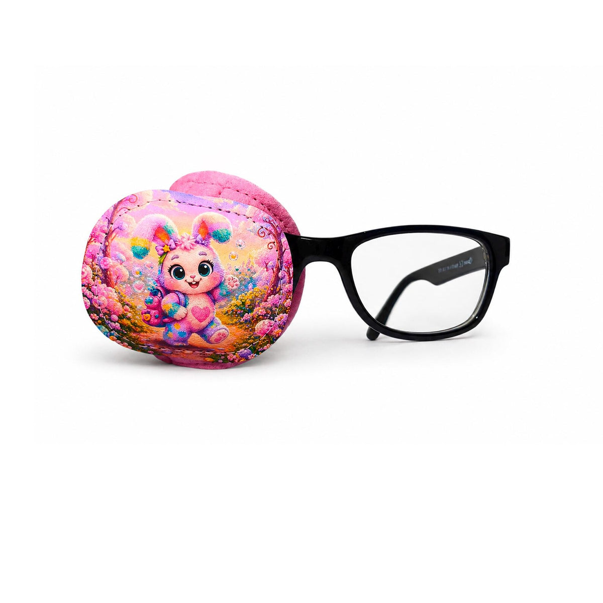 Full coverage eye patch with a colorful rainbow bunny surrounded by flowers on a pink background