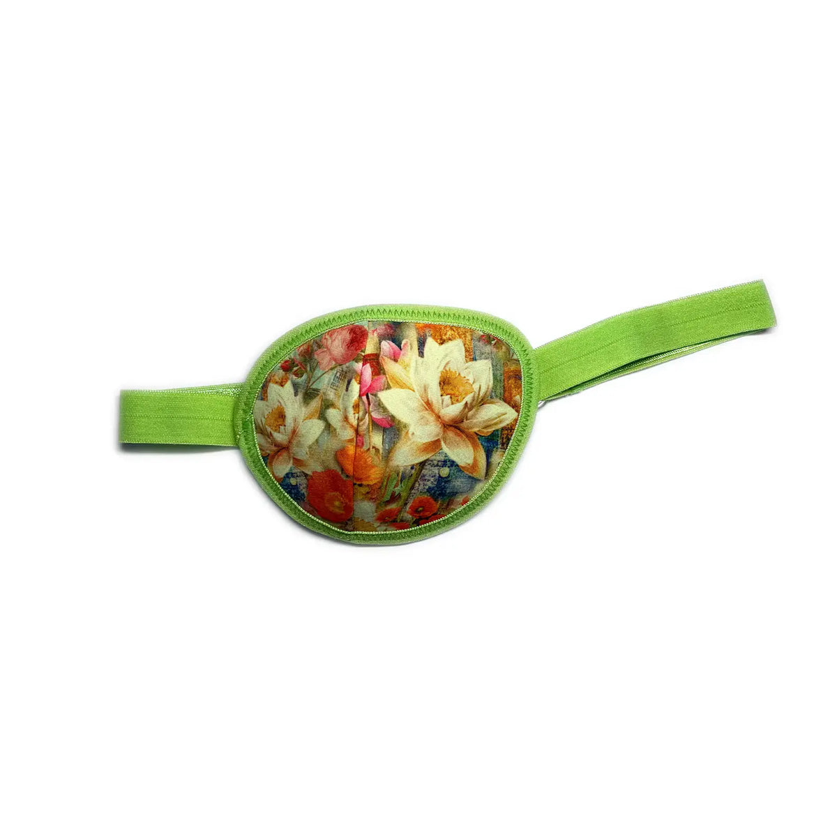 Pirate eye patch with bright green strap showing cream daffodils and red roses on a floral background